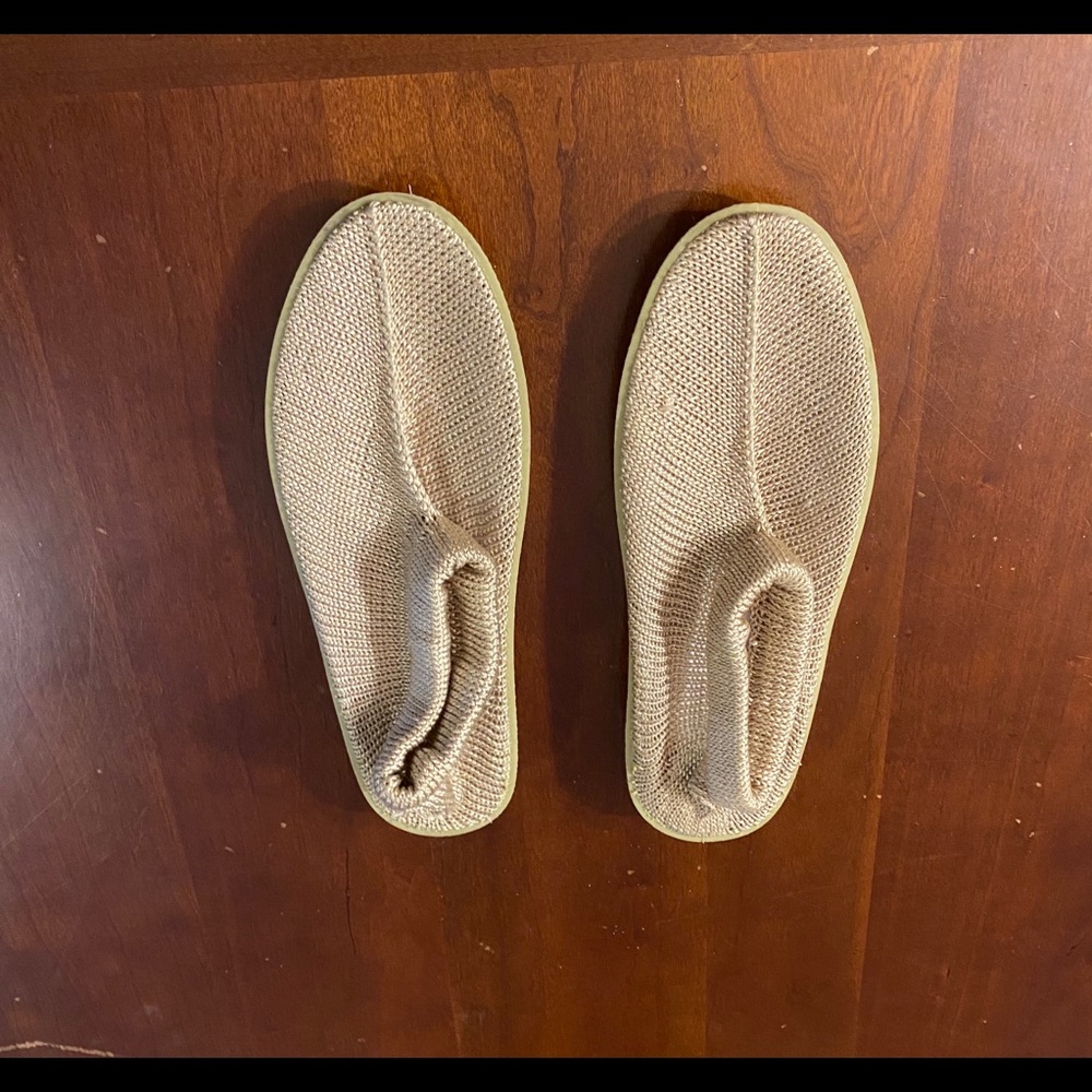 Beach slippers are a size Medium